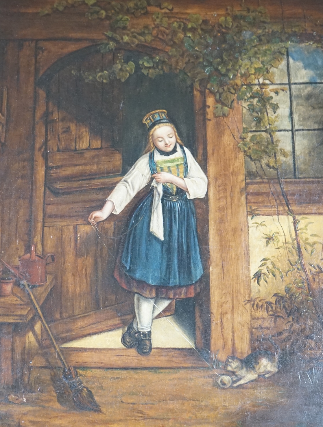 19th century, Dutch School, oil on canvas, Girl and kitten beneath a doorway, unsigned, 39 x 28cm. Condition - fair, repair visible to the reverse of the canvas